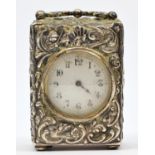 A Victorian boudoir clock, London 1898, retailed by Goldsmiths and Silversmiths, white enamel dial