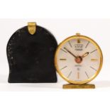 A Jaeger, eight day brass alarm clock, c.1960's, with textured body, diameter 4.5cm, case.