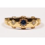 An Edwardian 18ct gold sapphire and diamond star gypsy set three stone ring, Birmingham 1905, T, 2.