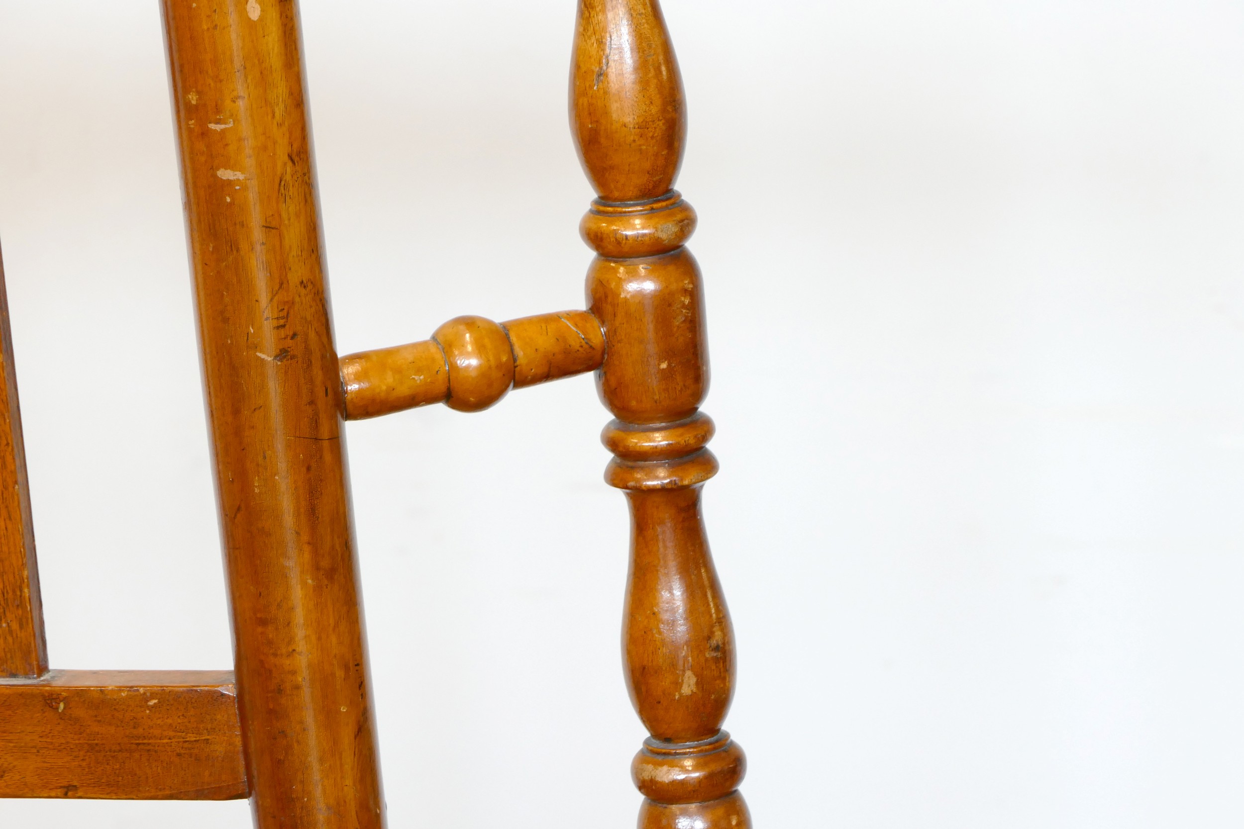 A 19th century Lancashire fruitwood winged rocking chair, having spindle back with rush seat, raised - Image 4 of 5