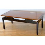 Ernst Gomme for G Plan- A 1950s Tola range teak Librenza pattern coffee table having a suspension