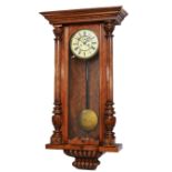 A 19th century Viennese double weight wall clock, the celluloid dial with Roman numerals, the