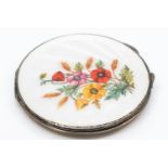 A silver and enamel powder compact, Birmingham 1940, floral decoration with white guilloche enamel