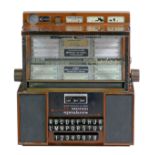 A Seeburg Consolette wall mounted jukebox, model SCH 3-4, with stereo speakers, three volume keys