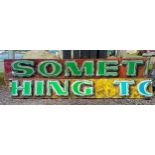 Two fairground ride main panels, wood with painted letters, "Something To", 220 x 30cm