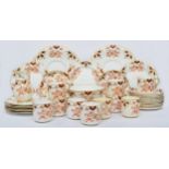 A Victorian tea service, gilt and red floral pattern, numbered 7988, comprising 10 tea cups, 12
