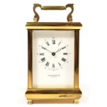 A Taylor & Bligh, brass striking carriage clock, white enamel dial with Roman numerals, the 11 jewel