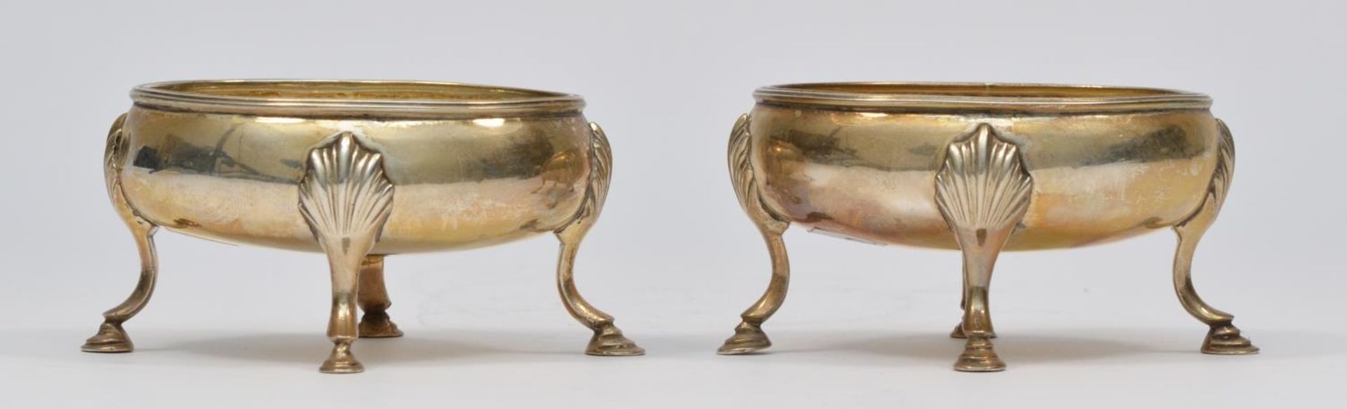 A George III silver pair of oval table salts, by Henry Chawner, London 1789, with reeded borders,