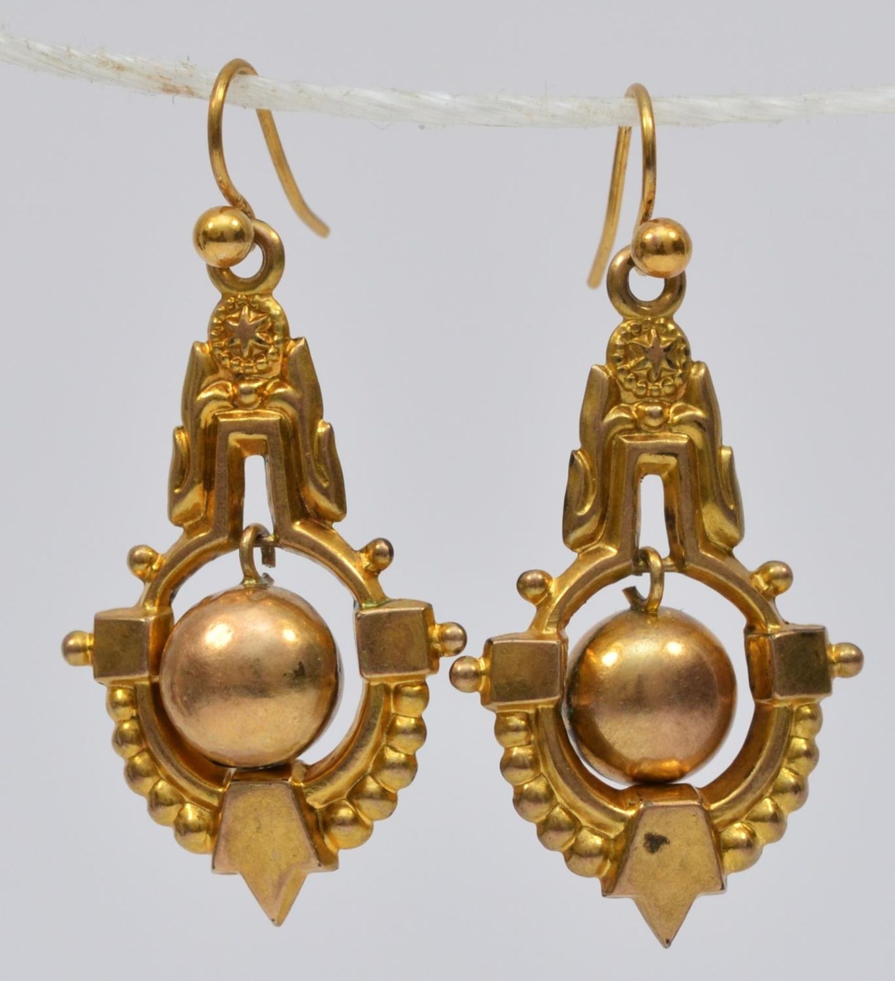 A Victorian pair of 9ct gold hollow drop ear rings, stamped 9c, articulated balls, 30mm, 2.6gm