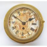 An early 20th century English brass 7" dial bulkhead clock, the off white dial with Roman numerals