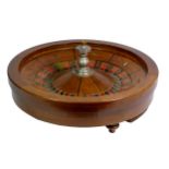 A F.Grote & Co, New York roulette wheel, mahogany base with inlaid ebony and cast metal baton