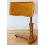 An Edwardian mahogany reading table, circa 1910, the shaped top with adjustable height and tilt