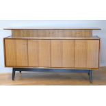 Ernst Gomme for G Plan - A 1950s teak sideboard from the Tola range, with three drawers, above two
