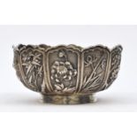 A Chinese silver bowl, by Wang Hing & Co., Hong Kong, each panel with different embossed and