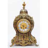 A 19th century French boulle mantel clock, the gilt dial with white enamel numerals, the shaped case