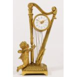 A 19th century French gilt brass mantel clock, the white enamel dial with a floral garland, with a