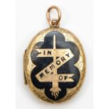 A Victorian gold and black enamel mourning locket, tests as 15ct, opening to reveal and original