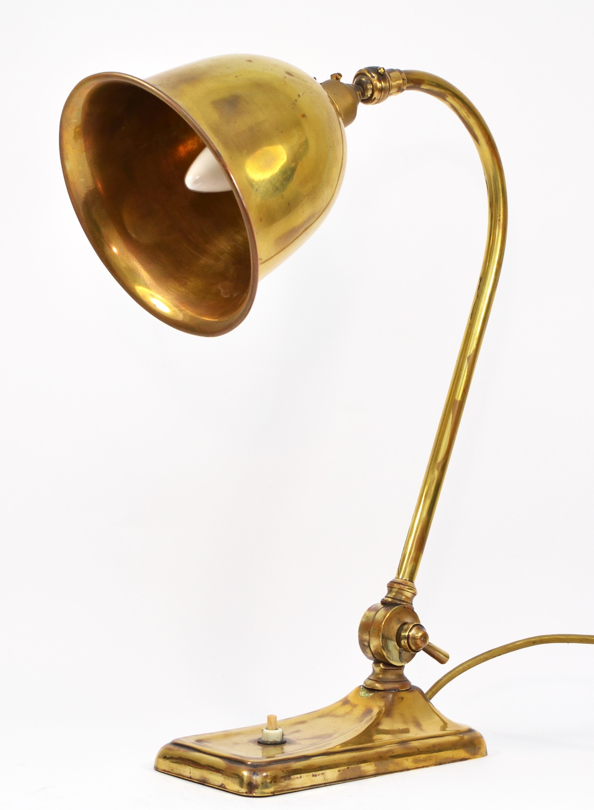 An early 20th century brass table lamp, bell shape shade, 42cm, rewired but untested.