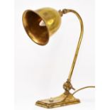 An early 20th century brass table lamp, bell shape shade, 42cm, rewired but untested.