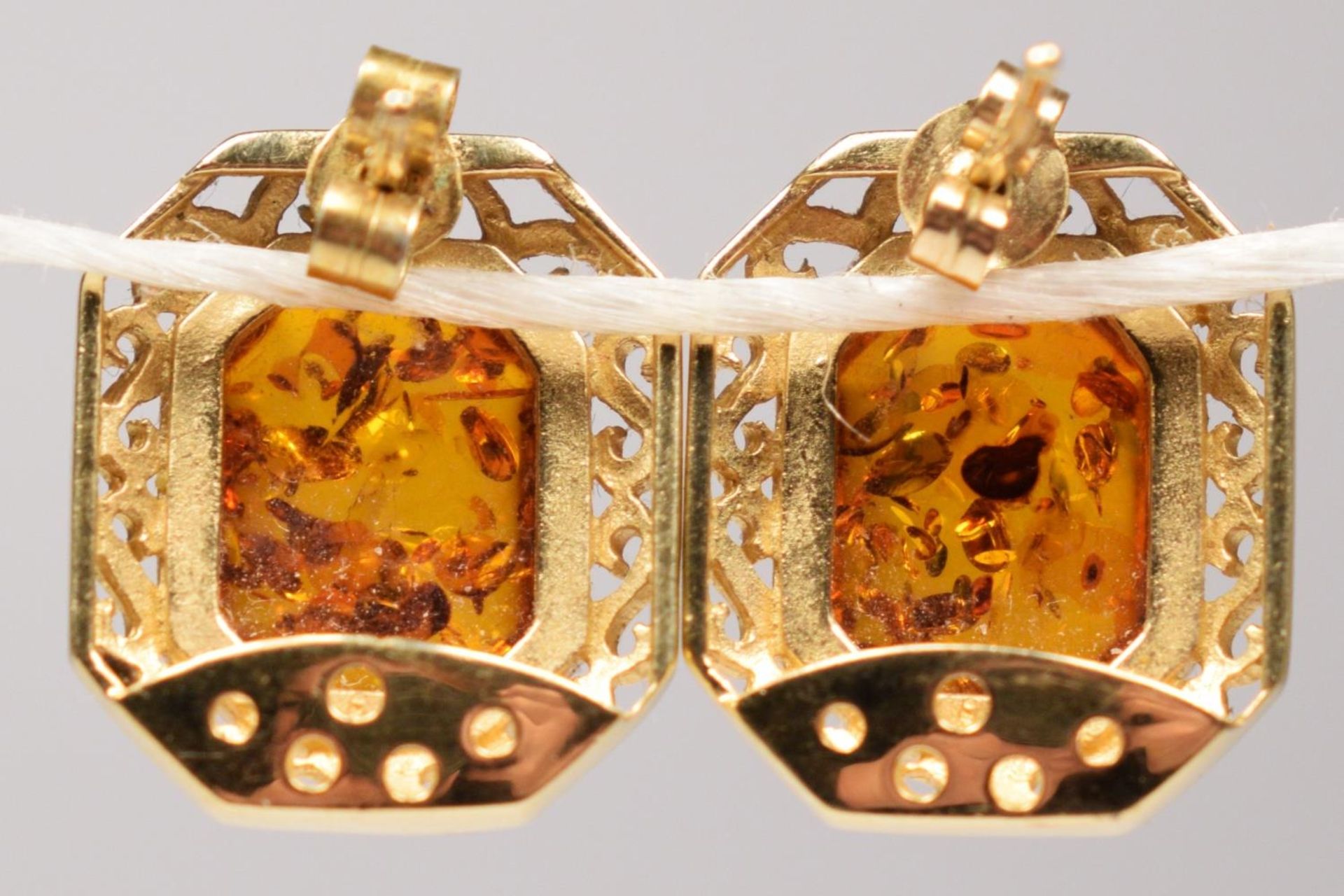 A continental 14k gold and amber pair of ear studs, bearing control marks, 18 x 15cm overall, 5.8gm. - Image 2 of 2