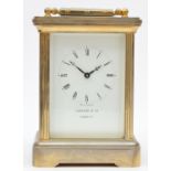 Garrard & Co., London, a large brass striking carriage clock, the white enamel dial with Roman