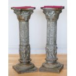 A pair of bronzed metal plated resin columns, acanthus leaf capital to a floral column, female music