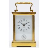 Matthew Norman, London, a brass alarm carriage clock, the white enamel dial with Roman numerals