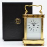 L'Epee, 1839, a French brass ogee shape carriage time piece, the white enamel dial with Roman