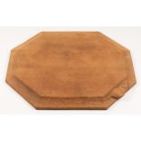 A Robert Mouseman Thompson of Kilburn, octagonal oak cheese board, with carved mouse trademark, 31 x