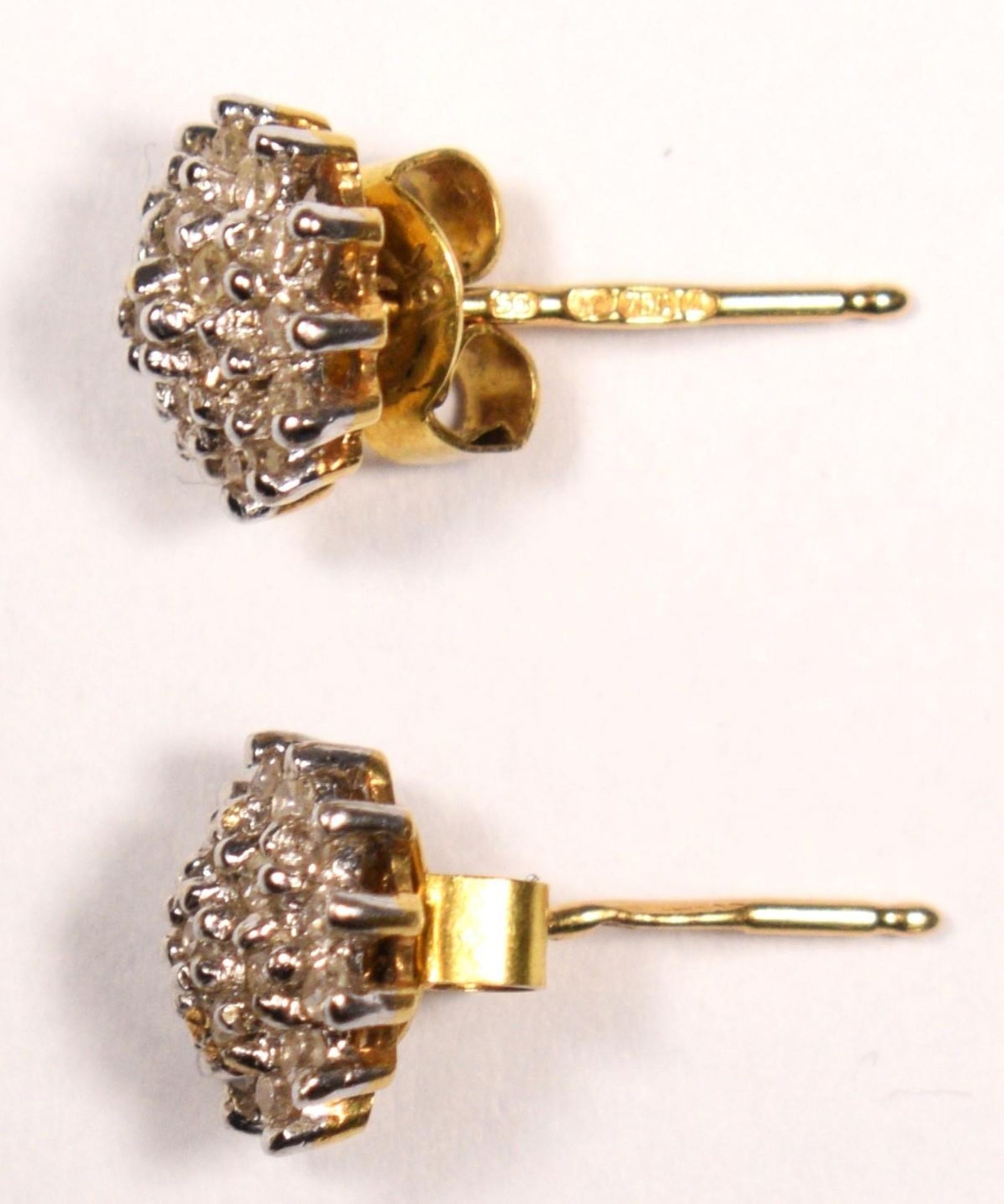 A pair of 18ct gold and diamond cluster ear studs, stated weight 0.28cts, diameter 8mm, 2gm. - Image 2 of 2