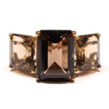 A vintage 9ct gold and smokey quartz three stone ring, the largest 14 x 9mm, N, 6.4gm.