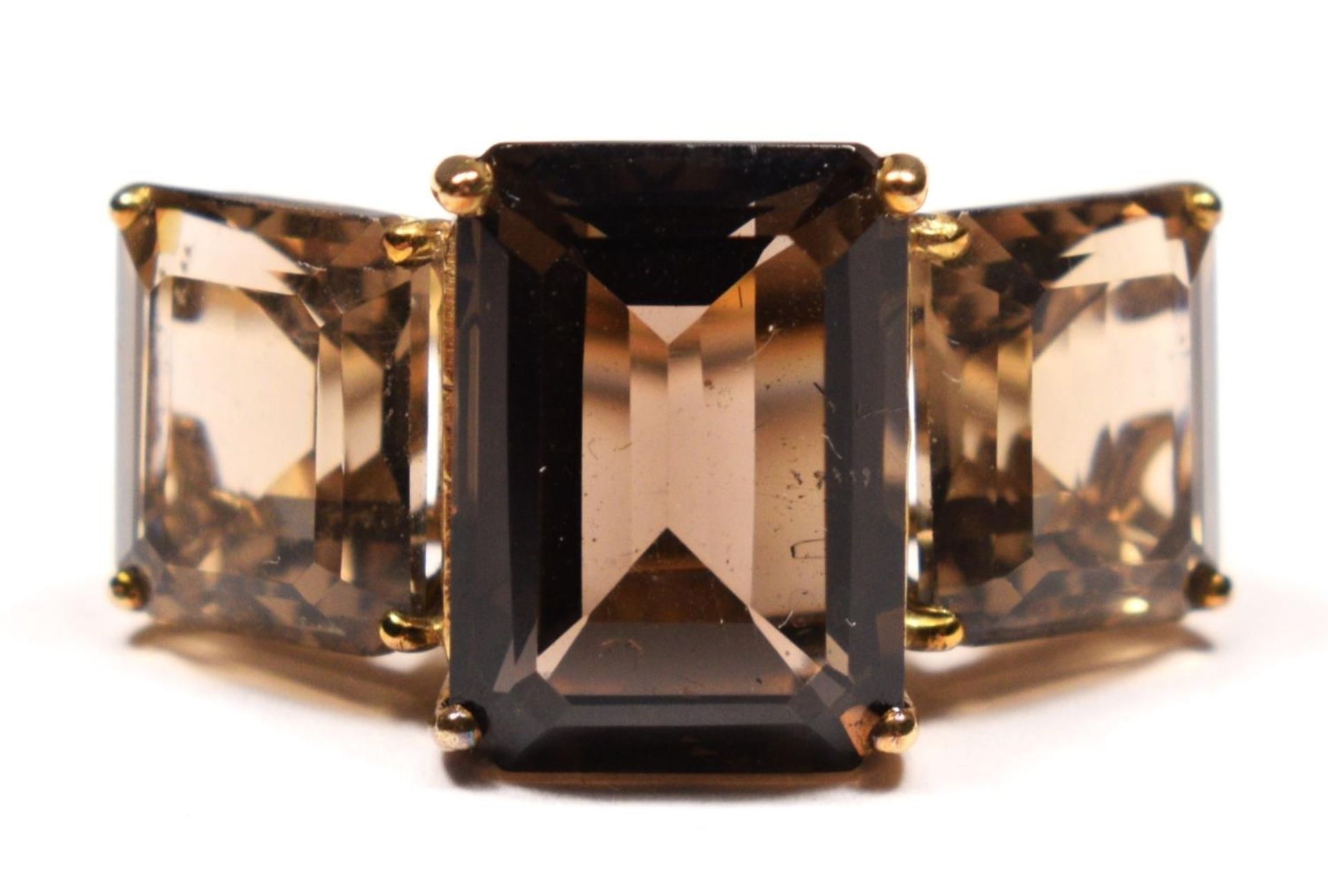 A vintage 9ct gold and smokey quartz three stone ring, the largest 14 x 9mm, N, 6.4gm.