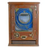 An Allwin De Luxe penny slot machine, c.1920's, oak cabinet, with internal metal ball track, pierced