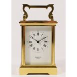 A Harold Cox, Windsor, brass striking carriage clock, white enamel dial, the 13 jewel movement