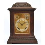 Winterhalder & Hofmeier, a German oak case mantel clock, silvered chapter ring with slow/fast and