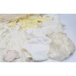 A selection of babies christening clothing to include eight christening gowns of different styles