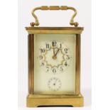 A brass carriage alarm time piece, off white dial with floral garland, and subsidiary alarm dial,