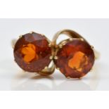 A vintage 9ct gold and two stone citrine crossover ring, diameter 9mm each, R 1/2, 6.7gm