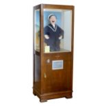 A coin operated arcade automaton, Laugh with Jolly Jack, wooden case with three glazed sides,