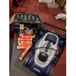 A Spear & Jackson lawnmower, together with a Braun CareStyle 3 steam iron and assorted tubes of