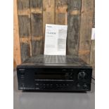 A Onkyo AV receiver, TX-DS595, with manual and a selection of speaker cables