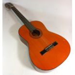 A Harmony company acoustic guitar, model H6134, with case