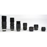Seven manual camera lens, to include a WEP 85mm-205mm f3.8, a Miranda 35mm-135mm f3.5-f4.5, a Hoya