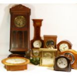 A collection of quartz and mechanical clocks, to include wall clocks, bulk head style clocks,