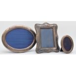 A silver oval photograph frame, Sheffield 1992, 22 x 17.5cm, another Sheffield 1983, 11 x 8.5cm