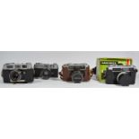 Four rangefinder 35mm film cameras, to include a Konica auto 52, a Mamiya Rank, cased, a Yashica