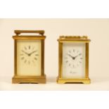 Two English brass carriage clocks, having 8 day movements, 12cm tall - for spares or repair. (2)