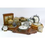 A collection of mid 20th century and later mantel clocks, carriage clocks and barometers, having