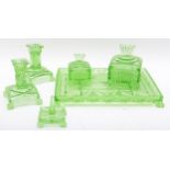 A 1950s six piece green glass dressing table set.