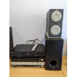 A Wharfedale DVD24F DVD player, together with a Pacific DVD player and a Panasonic DVD player,